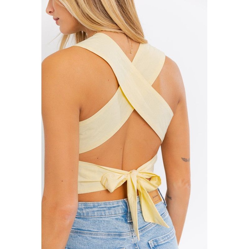 SLEEVELESS SMOCKED PEPLUM TOP