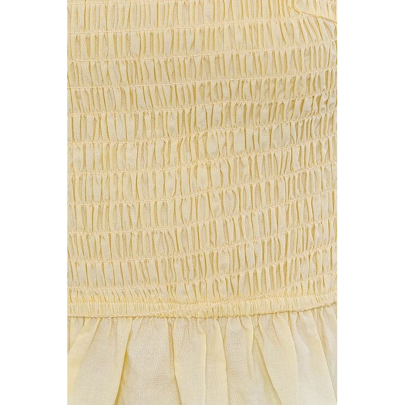 SLEEVELESS SMOCKED PEPLUM TOP