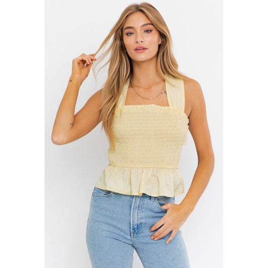 SLEEVELESS SMOCKED PEPLUM TOP